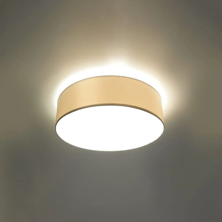 Plafon ARENA 35 cm 2xE27 to biała lampa montowana bezpośrednio na suficie. Minimalistyczna forma nie przytłacza wnętrza, a dwa wymienne źródła światła zapewniają funkcjonalne oświetlenie. Żarówki nie są dołączone.