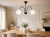 Czarna lampa sufitowa FRIDA Lemir z trzema białymi, matowymi kloszami i chromowanymi detalami. Model 3xE27 o średnicy 45 cm efektownie oświetli salon, jadalnię, kuchnię lub sypialnię.