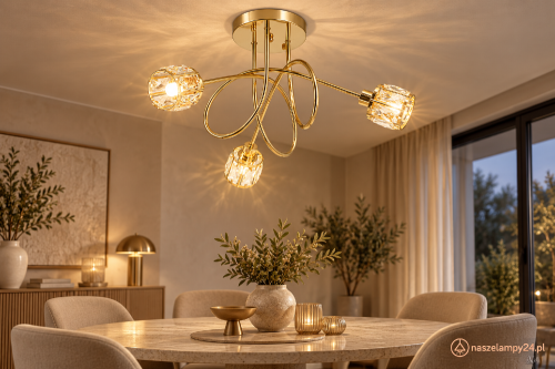 Złota lampa sufitowa AURORA Elem 6510/3 TR zachwyca przeplatającymi się ramionami i trzema szklanymi kloszami. Model 3xE14 o szerokości 57 cm i wysokości 30 cm pasuje do salonu, jadalni oraz sypialni w stylu glamour.