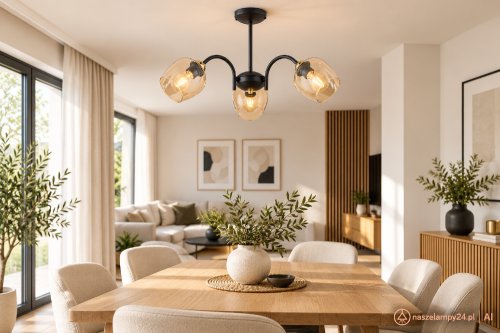 KATLA O3063 W3 CZA + ZL to czarna lampa sufitowa z trzema półprzezroczystymi kloszami bursztynowymi. Oprawa 3xE27 sprawdzi się nad stołem, w salonie lub jadalni. Złote dodatki, wymiary 50 × 40 cm i praktyczny podział światła 2+1.